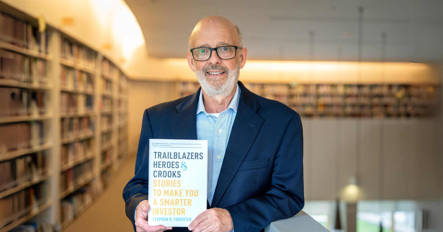 Stephen Foerster Holds Newly Published Book In Ivey Library Banner