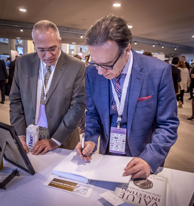 George Athanassakos signing his book for Eric Almanza