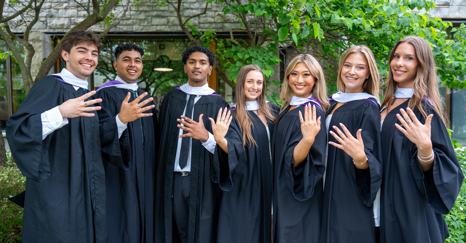 A Group Of Ivey Graduates Showing Off Their Rings