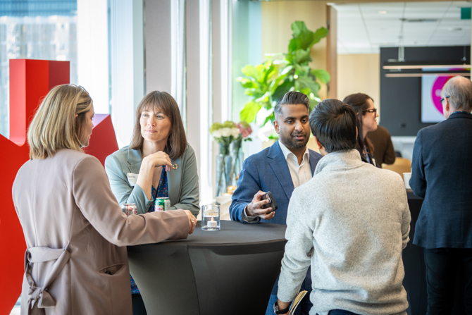 Attendees networking at the event