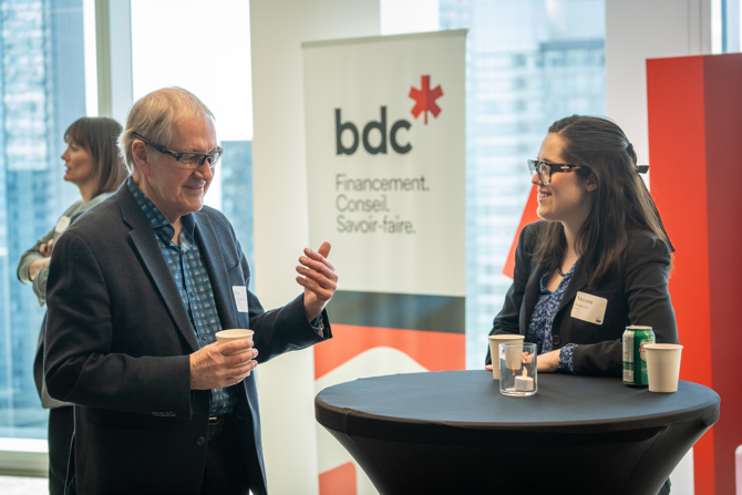 Attendees networking at the event
