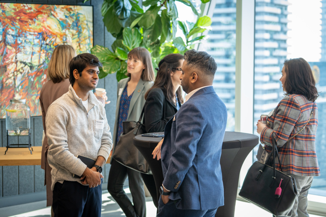 Attendees networking at the event